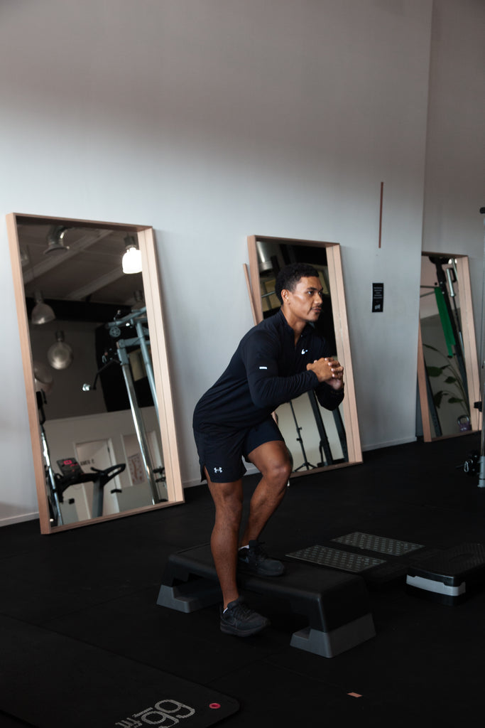 RehabCo Physio specialist providing detailed feedback to an athlete following performance screening in Auckland and Wellington