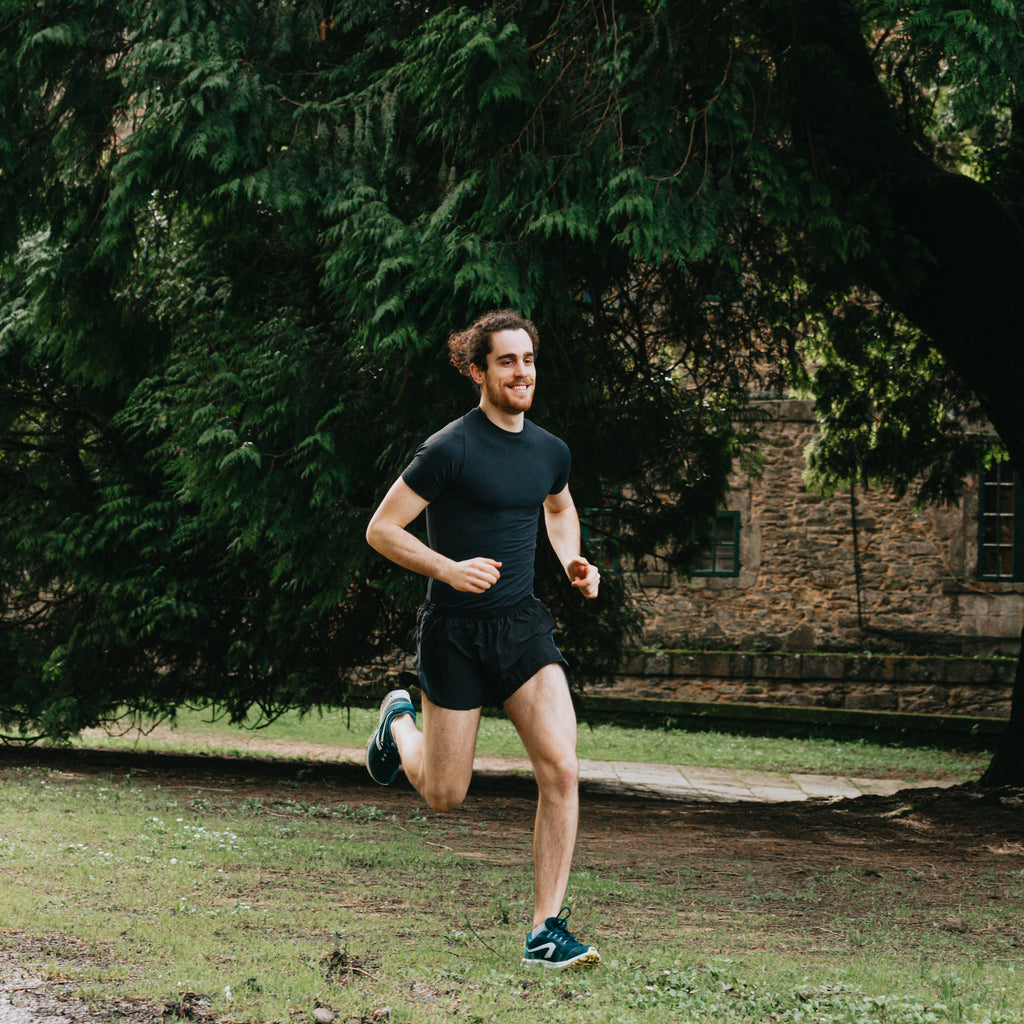 Detailed running gait analysis being performed to identify movement inefficiencies in an athlete